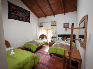 Postel nebo postele na pokoji v ubytování Hotel Inka King