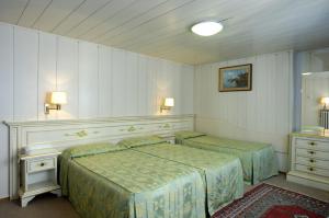 Voodi või voodid majutusasutuse Albergo Basilea toas