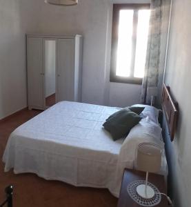 Postel nebo postele na pokoji v ubytování B&B Ginestra