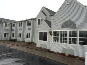 a row of houses in a row at Microtel Inn by Wyndham Henrietta in Henrietta