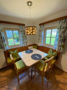 a dining room with a table and chairs at Ferienwohnung Engl Haus in Altaussee