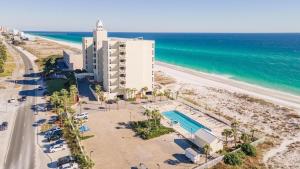 an aerial view of a hotel and the beach at A Wave From It All in Pensacola Beach