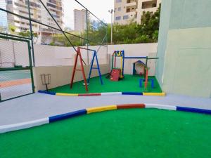 an empty play area with a playground at El Peñon del Rodadero Apartamento Playa Rodadero 8 in Puerto de Gaira