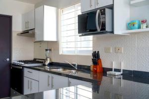 Η κουζίνα ή μικρή κουζίνα στο Lindo departamento en privada. +7 φωτογραφίες