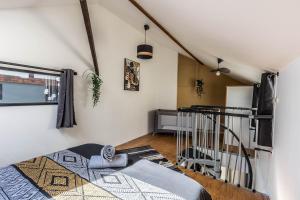 Posteľ alebo postele v izbe v ubytovaní L'Atypique-Le LOFT du Mans