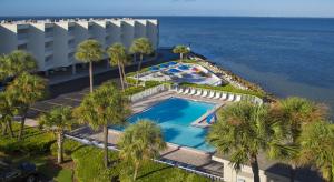 an overhead view of a swimming pool next to the ocean at Sailport Waterfront Suites in Tampa