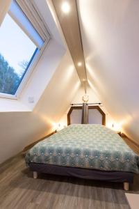 Łóżko lub łóżka w pokoju w obiekcie Le Puits Jaune - Gîte Nature et Spa