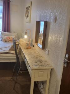 a room with a desk and a bed and a desk at 140 Bond in Blackpool