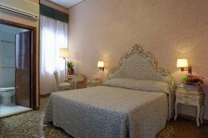 Letto o letti in una camera di Albergo Basilea