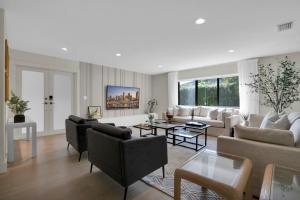 a living room with a couch and a table at Miami GEM in Miami