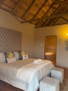 a bedroom with two beds in a room at Matori Lodge in Modimolle