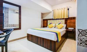 Postel nebo postele na pokoji v ubytování KALPANA RESIDENCY - A Family Hotel