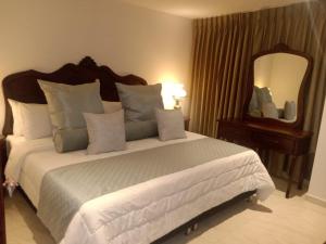 Postel nebo postele na pokoji v ubytování Hotel Dorado Plaza Boutique Calle del Arsenal