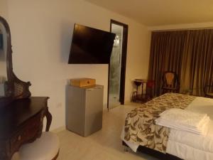 Postel nebo postele na pokoji v ubytování Hotel Dorado Plaza Boutique Calle del Arsenal