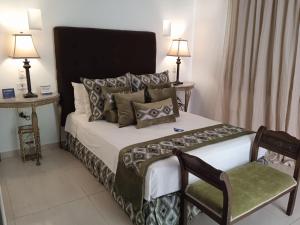 Postel nebo postele na pokoji v ubytování Hotel Dorado Plaza Boutique Calle del Arsenal