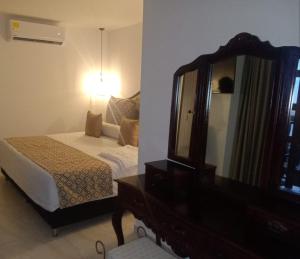 Postel nebo postele na pokoji v ubytování Hotel Dorado Plaza Boutique Calle del Arsenal