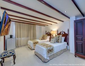 Postel nebo postele na pokoji v ubytování Hotel Dorado Plaza Boutique Calle del Arsenal