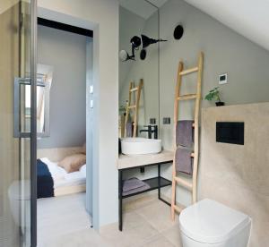 Łóżko lub łóżka w pokoju w obiekcie Apartamenty Łasica Jaworki