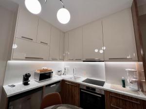 Kuchyň nebo kuchyňský kout v ubytování 'Amaryllis Home' ,το σπίτι σας