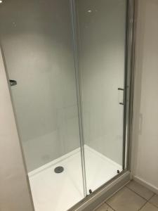 a shower with a glass door in a bathroom at The Annexe Bedford in Bedford