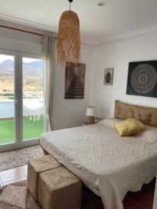 Postel nebo postele na pokoji v ubytování Casa Energía del Cabo. San Jose Cabo de Gata.