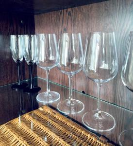 a group of wine glasses sitting on a table at Luxurious Holiday Apartment in Warsaw in Warsaw