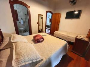 Postel nebo postele na pokoji v ubytování Casarão Paraty