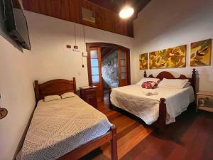 Postel nebo postele na pokoji v ubytování Casarão Paraty + 34 fotografií