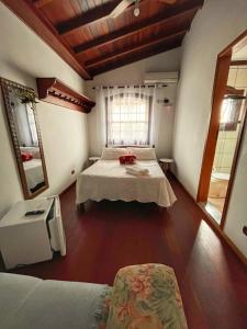 Postel nebo postele na pokoji v ubytování Casarão Paraty