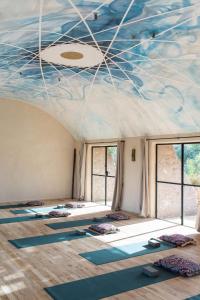 a room with a bunch of yoga mats on the ceiling at Slow Luxury at the Serai in Essaouira