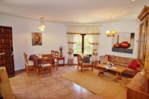 a living room with a couch and a table at Monica II - holiday home with private swimming pool in Benissa in Benissa