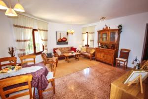 a living room with a couch and a table at Monica II - holiday home with private swimming pool in Benissa in Benissa