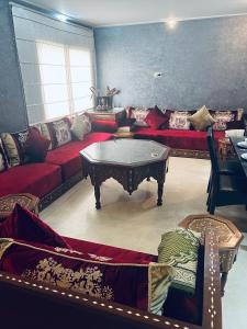 a living room with a couch and a coffee table at Deluxe apartments in Casablanca