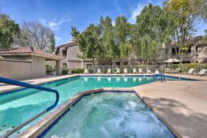 a swimming pool with blue water in a house at Scottsdale Condo Pool, Hot Tub and Grill Access! in Scottsdale