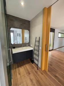 a bathroom with a sink and a mirror at Casa para 8 personas en Berga - ALBERGA in Berga