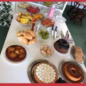 a table topped with lots of different types of food at Hotel Dunas Village Cumbuco in Cumbuco