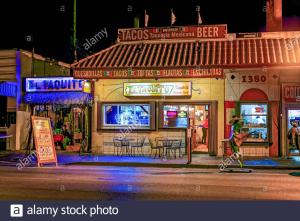 a restaurant on a city street at night at Coral Gable Studio & House Free Parking & Wifi in Miami