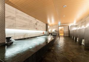 a hallway with a pool of water in a building at APA Hotel Omori Ekimae in Tokyo