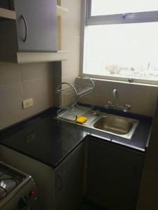 a kitchen counter with a sink and a window at Apartamento en La Paz in La Paz