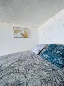 Postel nebo postele na pokoji v ubytování OLotus Studio Punaauia