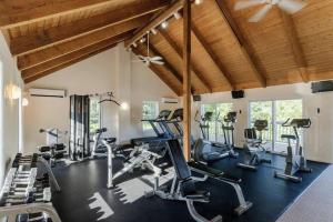 a gym with several treadmills and exercise bikes at Fall Cottage that Sleeps 6 with 2 Bedrooms Sun Room Jaccuzi 1 Mile to Beach! in Wells