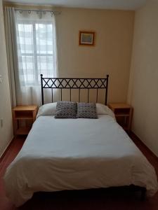 Letto o letti in una camera di J&K Suite