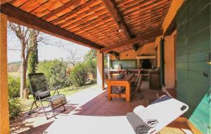 an outdoor patio with a wooden pergola at Lovely Home In Fox Amphoux With Kitchen in Fox-Amphoux