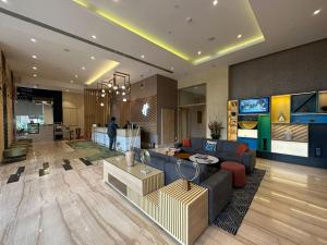 a living room with a couch and a table at Holiday Inn Bengaluru Racecourse, an IHG Hotel in Bangalore