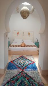 Postel nebo postele na pokoji v ubytování Kasbah ait Moussa