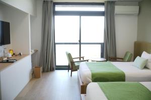 Postel nebo postele na pokoji v ubytování gran terrace Le Lien Hakone