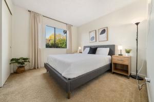 a bedroom with a large bed and a window at Delightful Home w Fireplace Patio Fire Pit in Roseville