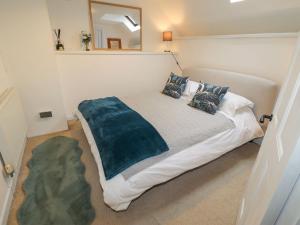a bedroom with a large bed in a room at 1 The Barn in Haverfordwest