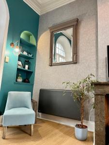 Televízia a/alebo spoločenská miestnosť v ubytovaní Gîte Les Hauts de Boulogne