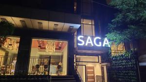 a saccara sign on the side of a building at The Saga Hotel in New Delhi
